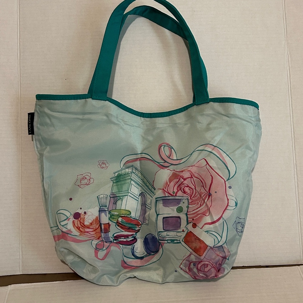Lancôme Reversible WovenTeal and print stylish Tote Bag.  Perfect take along.